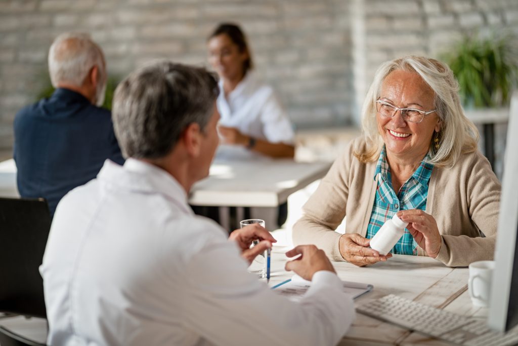 Doctor explaining Medicare vs Medicaid to a patient
