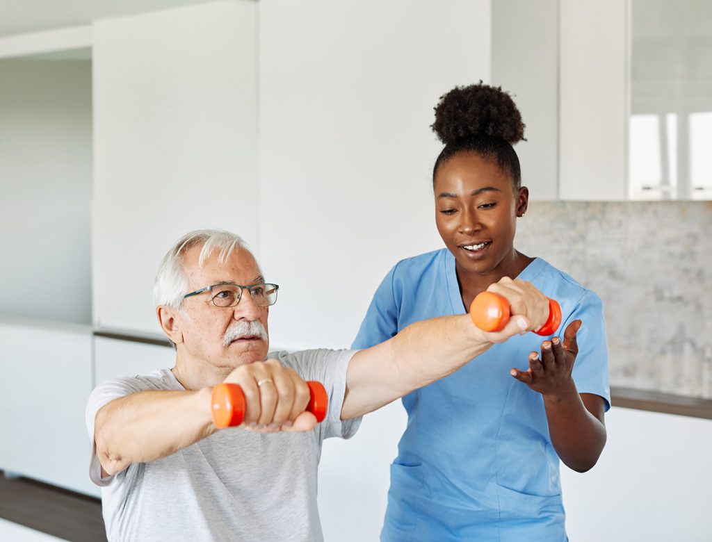 Caregiver and patient at a short-term physical rehab facility in Erie, PA