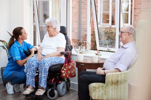 Residents and a caregiver at a personal care home in Erie, PA