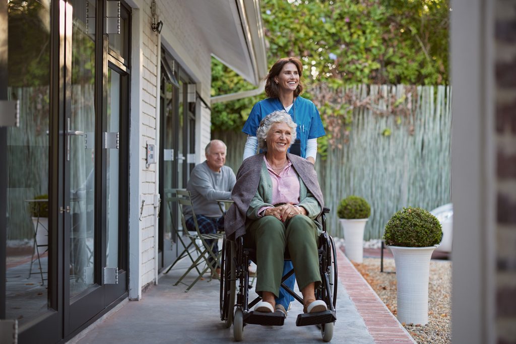 Residents and a care provider at one of the best personal care homes in Erie, PA